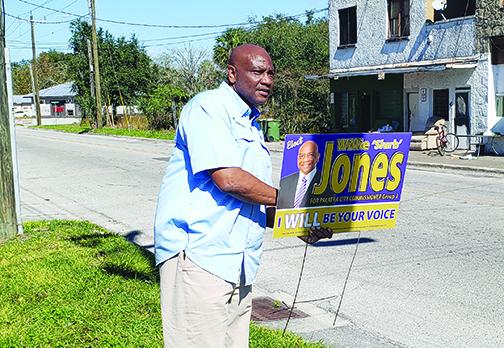 Palatka City Commission candidate Willie Jones gets ready to greet voters Tuesday on 11th Street in Palatka near the Price-Martin Community Center. Jones would eventually win the race.