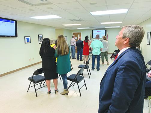 Superintendent Rick Surrency joins other local residents at the Supervisor of Elections Office on Tuesday night as elections results are broadcast on screens throughout the room.