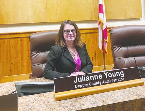 Newly-appointed Deputy County Administrator Julianne Young takes a seat on the Putnam County Board of Commissioners dais at the meeting chambers in Palatka as she reflects on her upbringing in the area and the previous work she’s done with the county before being promoted to her new role.