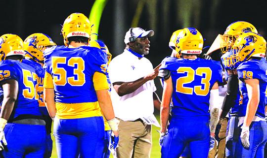 Willie Fells gives his Palatka High School football team instruction during last Friday’s state tournament playoff game against South Sumter. (GREG OYSTER / Special To The Daily News)