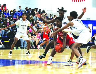 Middleburg’s Donovan Wimberly is surrounded by Interlachen’s Justin Herring (behind him) and Jaden Perry during Monday night’s opener at Interlachen High School. (MARK BLUMENTHAL / Palatka Daily News)