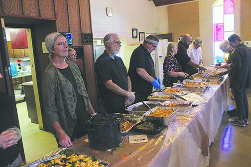 Bread of Life volunteers prepare to serve Thanksgiving last year at the church.
