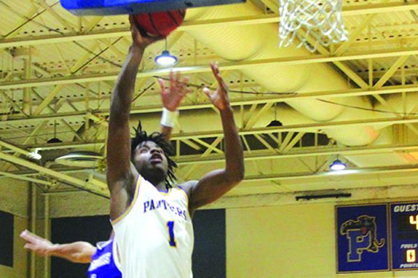 Palatka High’s Shemar Curry goes up for a layup against Gainesville High at home on Dec. 8. (MARK BLUMENTHAL / Palatka Daily News)