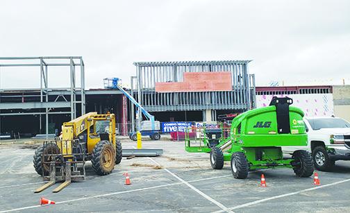 Equipment sits outside the old Kmart building in Palatka as work continues on what will soon become the retail chains Marshalls and Five Below.