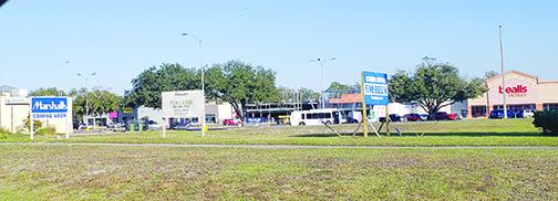 Signs announcing the construction of Five Below and Marshalls are on display in Palatka.