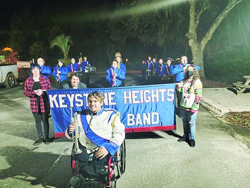 Keystone Heights High School marching band members play Saturday during the Bonnie Melrose Christmas of Parade of Lights.