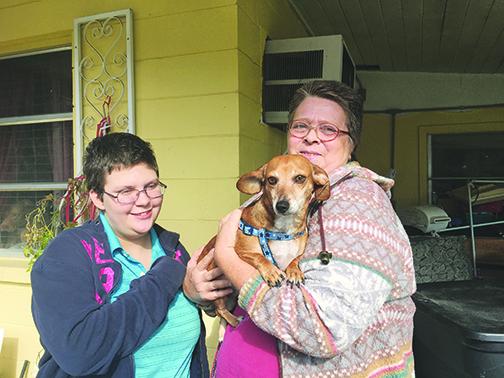 Bailey, Daisy and Chlo Richard stand together as a family and are some of the residents who benefited from the South Putnam Animal Network’s efforts. 