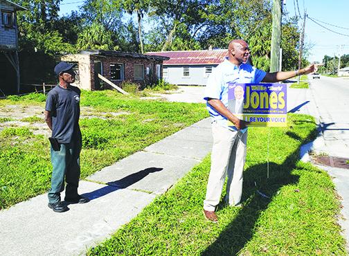 Willie Jones campaigns on 11th Street in November for a seat on the Palatka City Commission, which he would win in the general election.