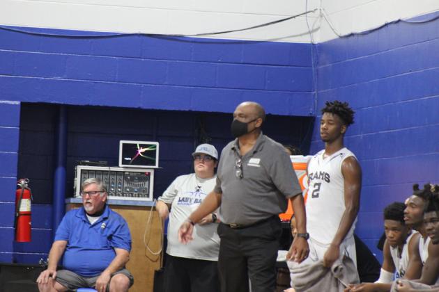 Interlachen head coach C.S. Belton stands next to player Der'Tavious Mack during the Rams' opening game of the season against Middleburg. (MARK BLUMENTHAL / Palatka Daily News)