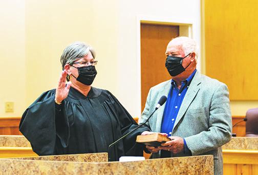 Putnam County Judge Elizabeth Morris gets sworn in Tuesday with her husband by her side at the Putnam County Government Complex.