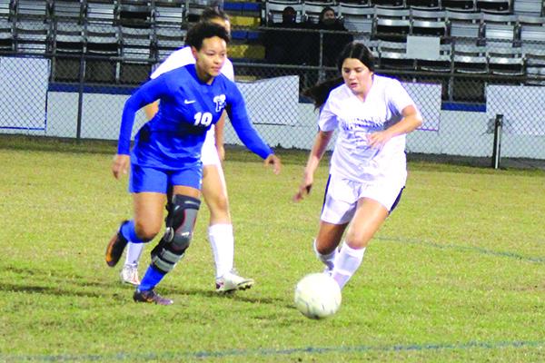 Palatka’s Natasha Mullen (left) chases after the ball against Crescent City’s Lili Escobedo during Wednesday night’s game won by Palatka. (MARK BLUMENTHAL / Palatka Daily News)