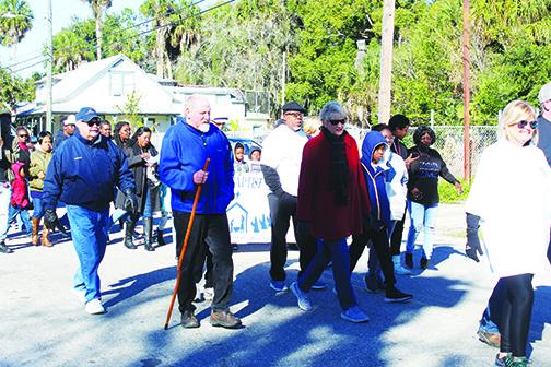 Hundreds of people begin the Martin Luther King Jr. Day parade last year in Palatka. This year’s event has been canceled.