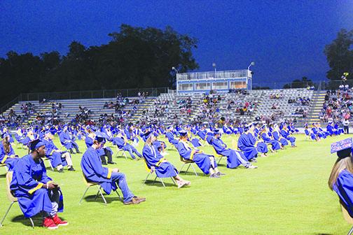 Palatka High School graduates listen to the keynote speaker during their belated commencement ceremony in August.