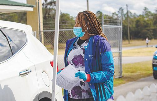 Nurse Danisha Allen prepares to give a Putnam County resident the coronavirus vaccine Friday.