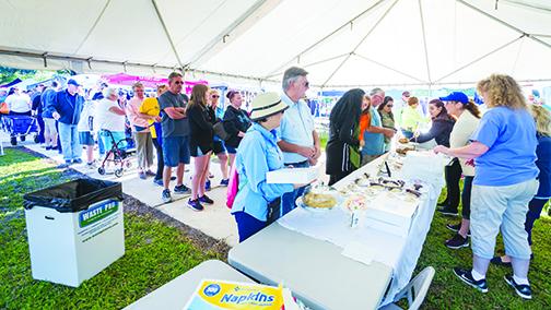 Droves of people line up for the famed blueberry pies during the 2019 Bostwick Blueberry Festival.