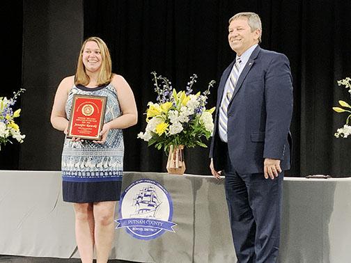 Mellon Elementary student-teacher Jennifer Rawski stands with Surrency after being named School-Related Employee of the Year on Tuesday night.