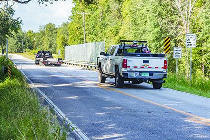 A truck drives over the Bardin bridge, which has been closed to larger vehicles.