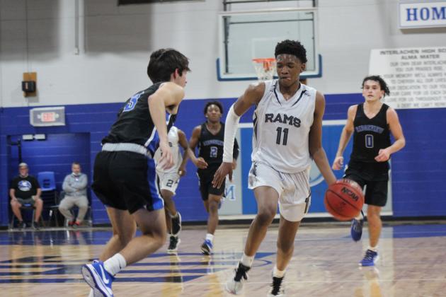 Interlachen’s Jaden Perry (11) looks to move the ball against Orange Park Ridgeview’s Nate Johnson during Tuesday night’s game, won by Ridgeview in double overtime. (MARK BLUMENTHAL / Palatka Daily News)