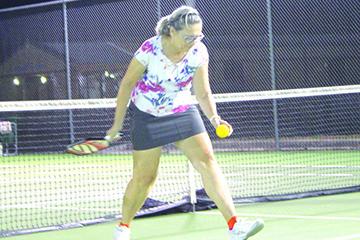 Pam Thompson delivers a serve during a pickleball match held at Palatka High in January. (ANTHONY RICHARDS / Palatka Daily News)
