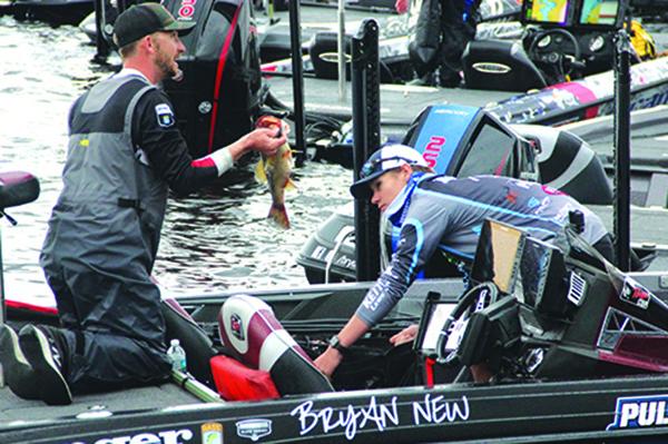 2021 Bassmaster Elite At St. Johns River champion Bryan New shows off one of his catches in his boat on Sunday at the Palatka Docks. (ANTHONY RICHARDS / Palatka Daily News)