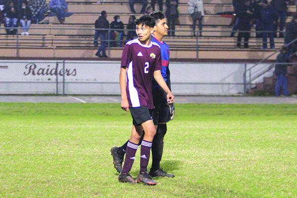 Crescent City’s Esquiel Vences (left) and goalkeeper Abelardo Ocampo walk off the field dejected after their team’s loss at home Wednesday against Jacksonville Episcopal in penalty kicks. (MARK BLUMENTHAL / Palatka Daily News)