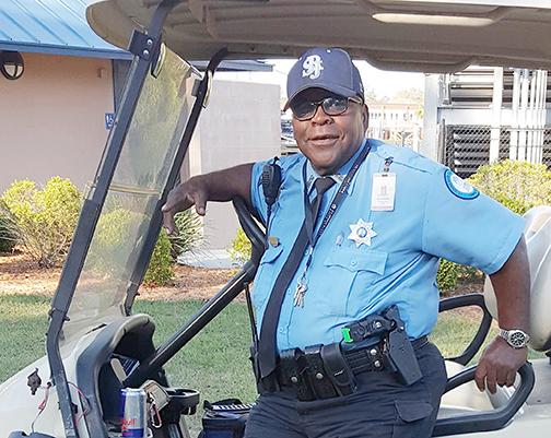 The late Earnest McRae, pictured riding a St. Johns River State College security vehicle, has had a scholarship named in his and another former guard’s honor.
