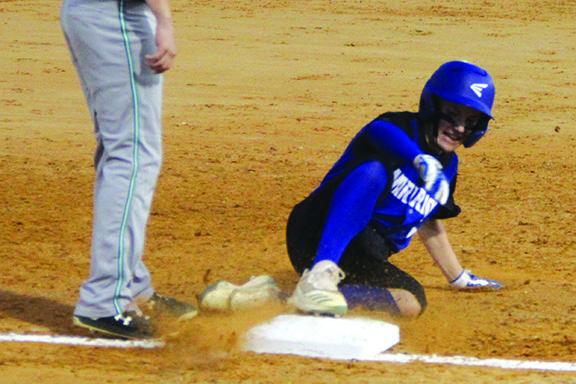 Peniel Baptist’s Jeremy Burnett slides safely into third base after stealing it during Tuesday’s game with Ocala Christian at Francis Youth Complex. (ANTHONY RICHARDS / Palatka Daily News)
