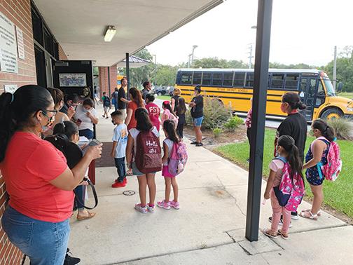 Parents and students gather last year for the first day of school at Middleton-Burney Elementary School in Crescent City.