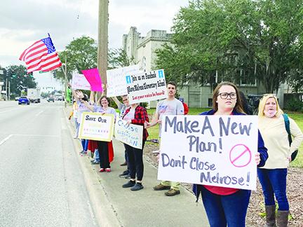 Protesters against closing Melrose Elementary School gather in front of Putnam County School District headquarters last month.