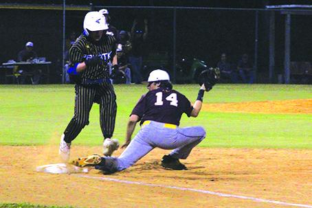 Palatka’s Hunter Keen is barely out at first base as Crescent City first baseman D.J. Hullett makes the play during the second inning of Monday’s Putnam County Tournament semifinal matchup. (ANTHONY RICHARDS / Palatka Daily News)