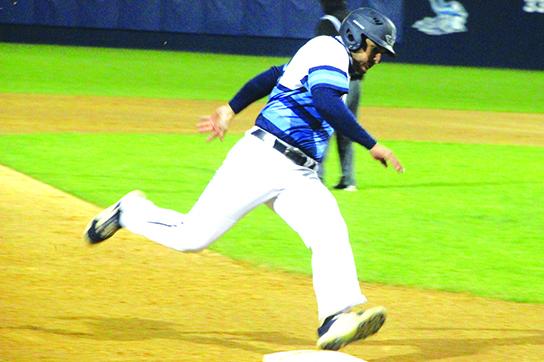 St. Johns River State’s Daniel Labrador rounds third base and heads home with a fourth-inning run against Lake-Sumter on Monday night. (ANTHONY RICHARDS / Palatka Daily News)