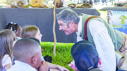 Mike Adams portrays William Bartram as he entertains children during the 2019 Bartram Frolic in Palatka. The event was canceled in 2020 because of COVID-19, but organizers are hoping to hold the event in April this year.
