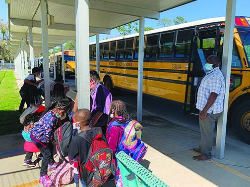 Mellon Elementary School students board buses after school concluded Thursday. Mellon is slated to close at the end of the 2020-2021 school year. 