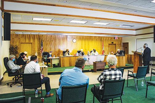 Crescent City commissioners discuss matters during a meeting in March.
