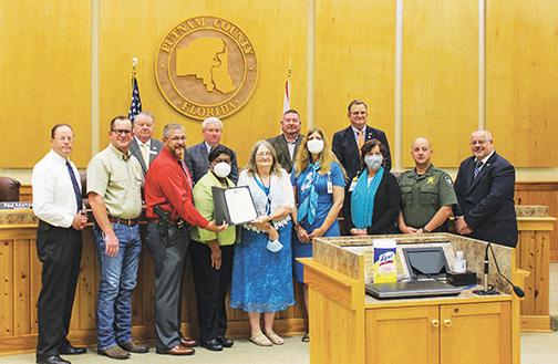 Putnam County Commissioners, minus Paul Adamczyk, gather with law enforcement and health officials to recognize April as Sexual Assault Awareness Month during Tuesday’s meeting.