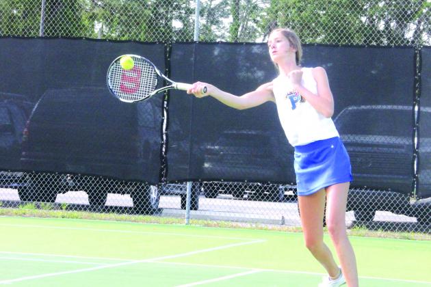 Palatka’s Ruby Doran returns a serve during her first doubles semifinal match. (ANTHONY RICHARDS / Palatka Daily News)