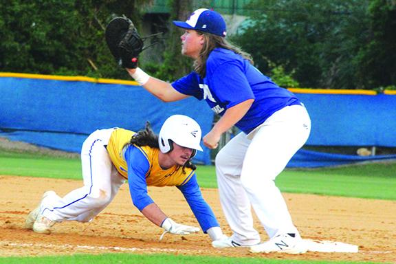 Palatka’s Layton DeLoach dives back into first base during Monday night’s loss at home against Keystone Heights. The Panthers travel to Port Orange Atlantic for a District 4-4A semifinal matchup with the Sharks on Wednesday. (ANTHONY RICHARDS / Palatka Daily News)