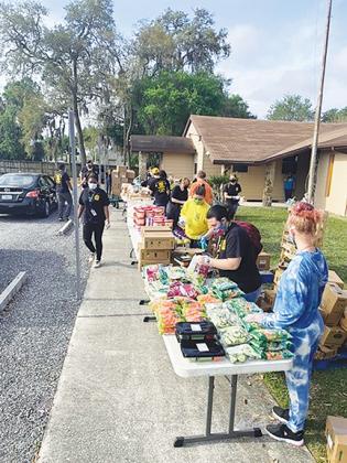 JROTC cadets at Interlachen High School gather food last week to give to families in need for a community service project at First Baptist Church of Interlachen.