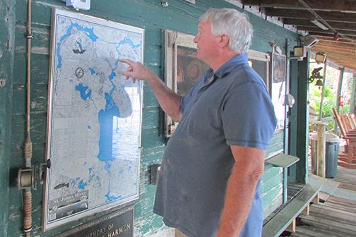 Jim Stege points to a map showing the location of Stegbone's Fish Camp on the St. Johns River.