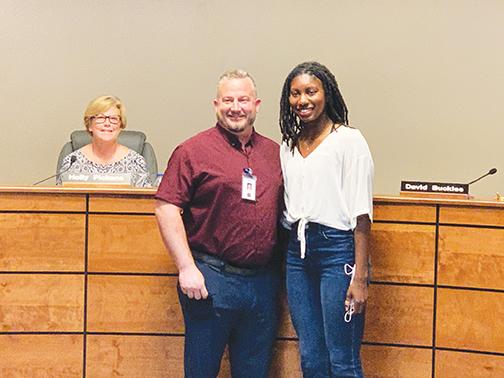 Interlachen High School Principal Bryan Helms, left, and IHS senior Reva Godbolt were honored at the Putnam County School District board meeting Tuesday.
