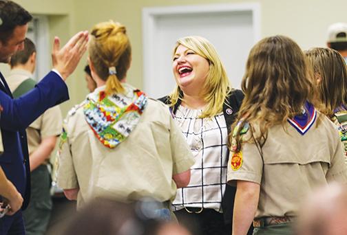 U.S. Rep. Kat Cammack laughs with female Eagle Scouts at the dinner.