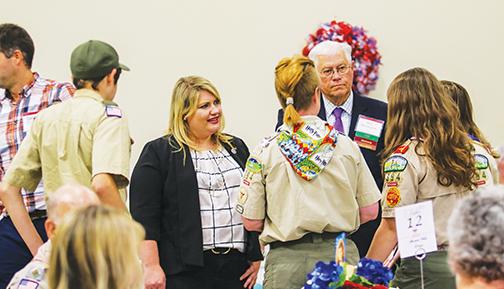 U.S. Rep. Kat Cammack speaks with Scouts and Honoree Bill Herrington at the Palatka American Values Dinner on Thursday.