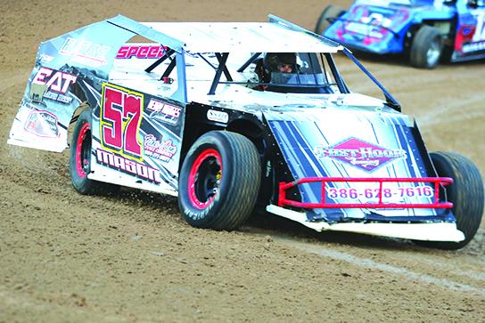 Fletcher Mason is coming out of turn four during the hot laps portion of the E-Modified class. Mason would go on to win the race later. (ANTHONY RICHARDS / Palatka Daily News)
