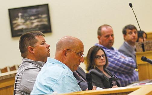 Putnam County department heads watch as Mike Troxel, the executive director of the Public Works Department, talks to the Board of County Commissioners on Monday about the department’s needs for the upcoming fiscal year.