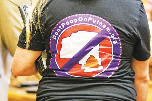 South Putnam residents wear “Don’t Poop on Putnam” shirts to a Board of County Commissioners meeting Tuesday to advocate not dumping biosolids near residential property.