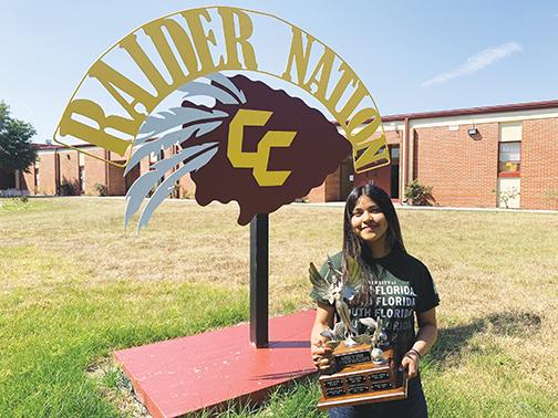 Crescent City High School senior Lizbeth Espinoza, the Putnam County School District’s top scholar for the 2020-2021 school year, holds the Robert W. Webb Award of Excellence she was awarded earlier this month.