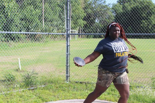 Palatka High sophomore Torryence Poole shows off her form with the discus during the same practice. (MARK BLUMENTHAL / Palatka Daily News)
