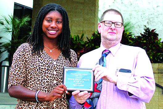 Recent Interlachen High graduate and three-sport standout Reva Godbolt is awarded the first-ever Daily News Senior Female Athlete of the Year honor by sports editor Mark Blumenthal. (ANTHONY RICHARDS / Palatka Daily News)