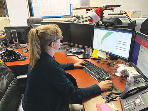 Emergency Management Specialist Danelle Choate checks the path of Tropical Storm Elsa while at the Emergency Operations Center on Wednesday.