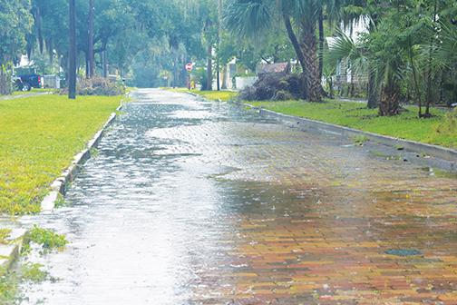Fifth Street in Palatka begins to flood Wednesday as Tropical Storm Elsa unloads rain throughout Putnam County.